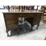 Twin pedestal office desk with green leather writing surface