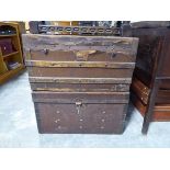 2 wooden banded twin handled travel trunks