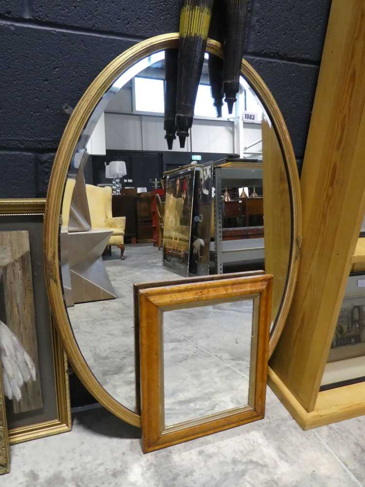 Gilt framed and bevelled oval wall mirror and one smaller walnut framed mirror