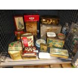 Cage containing a quantity of vintage tins