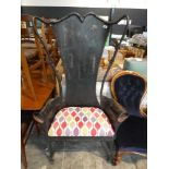 Large wrought metal armchair with bone decoration and geometric patterned seat cushion
