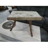 3 legged stool with rustic plank surface