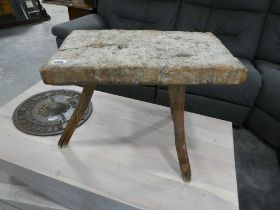 3 legged stool with rustic plank surface