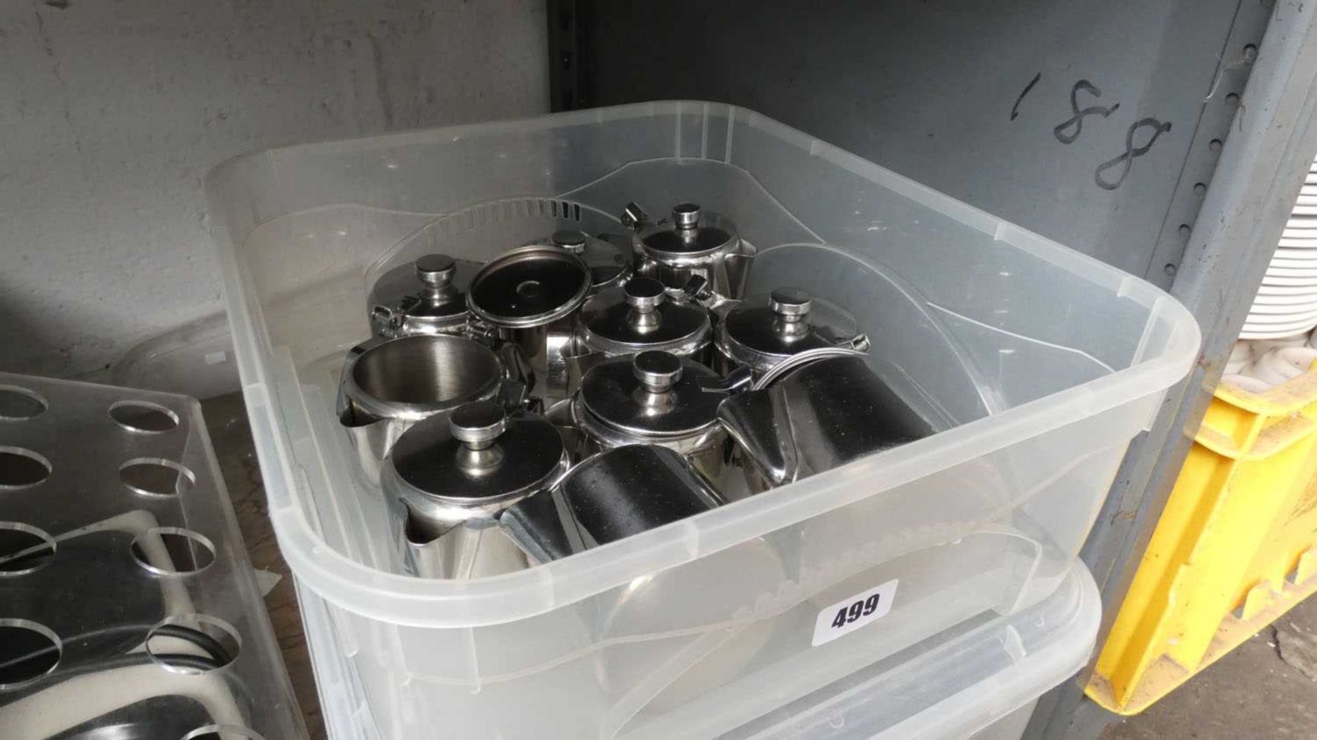 Tray of stainless steel teapots