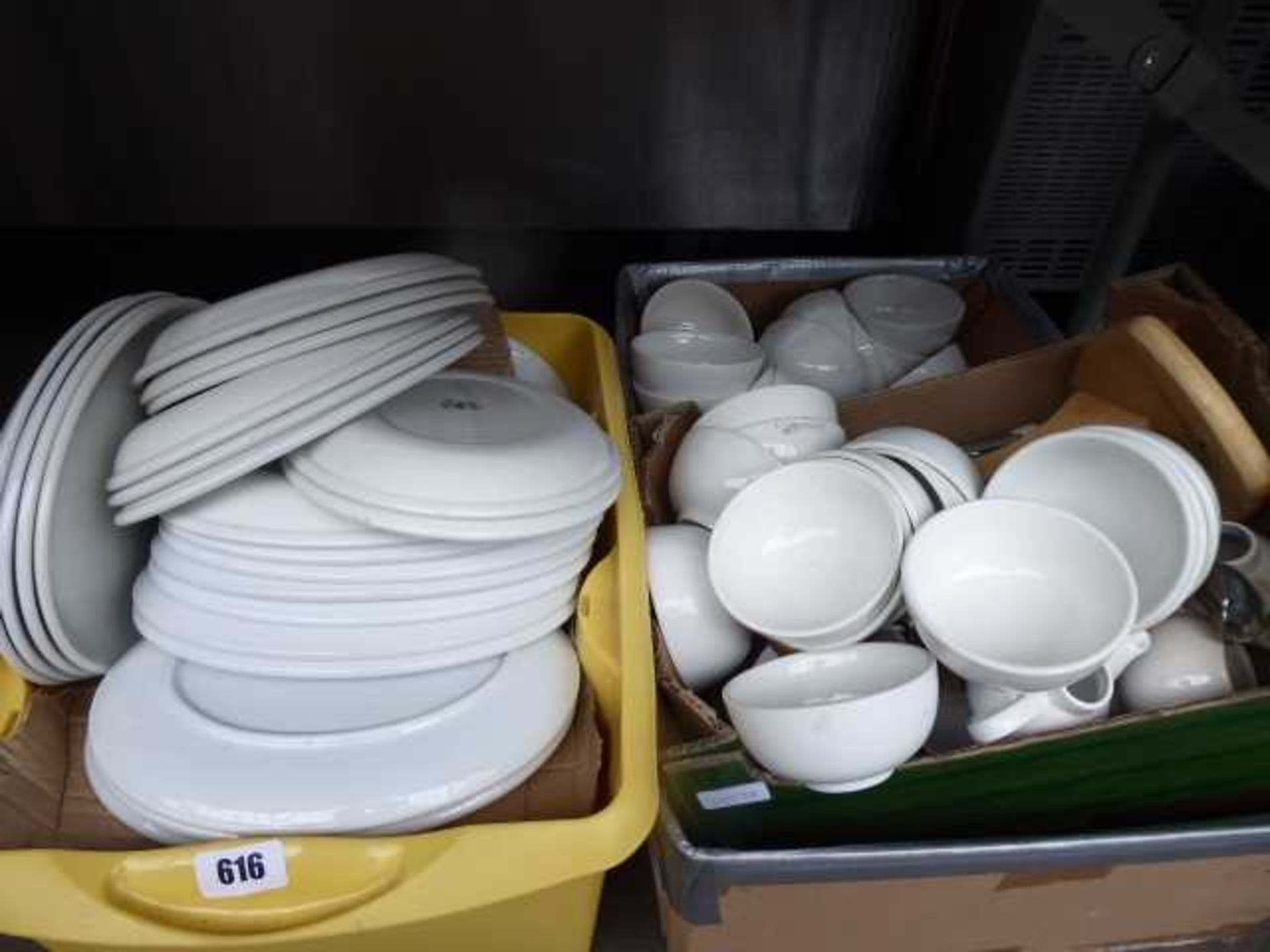 Under table of three boxes of white crockery to include soup bowls and oval platers
