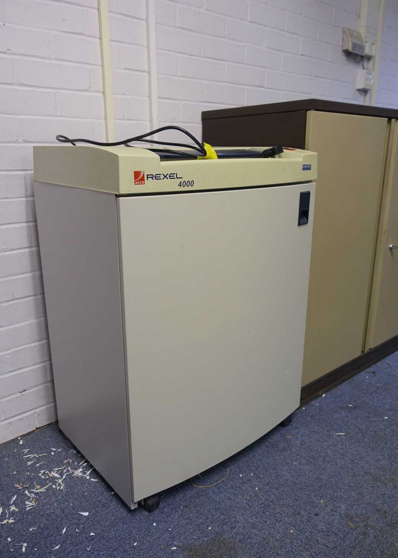 +VAT Rexel model 4000 paper shredder and a Triumph 2 door stationery cabinet