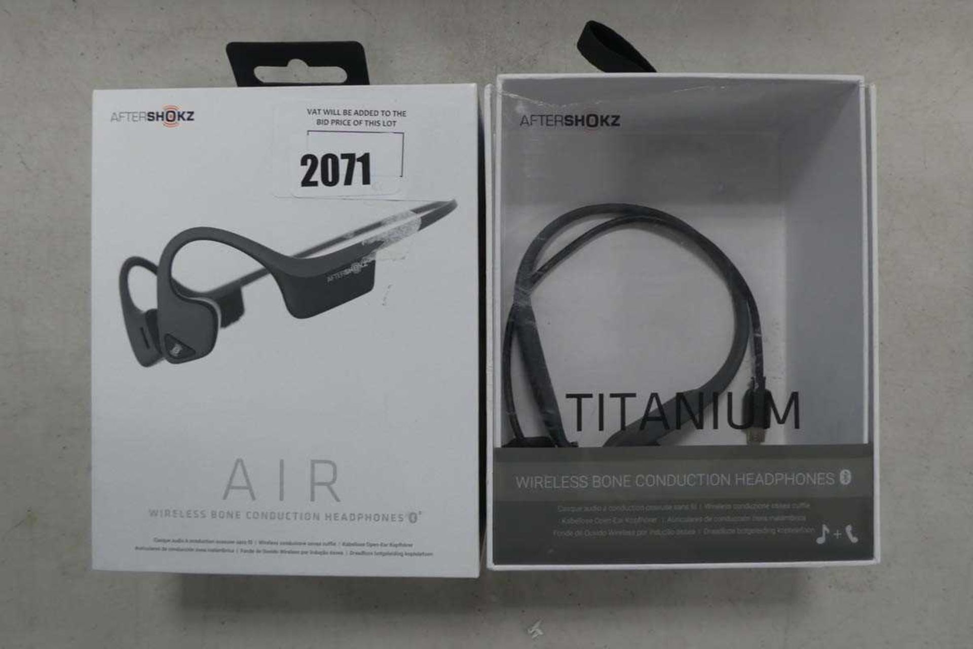 +VAT Aftershokz Air and Aftershokz Titanium bone conduction headsets in boxes