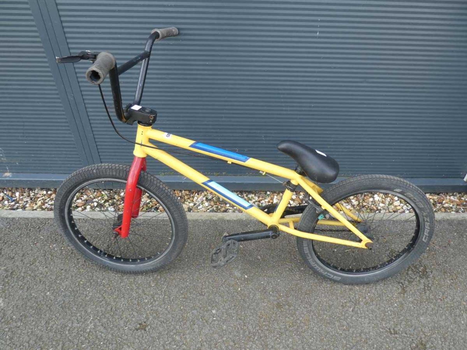 Small yellow and blue BMX