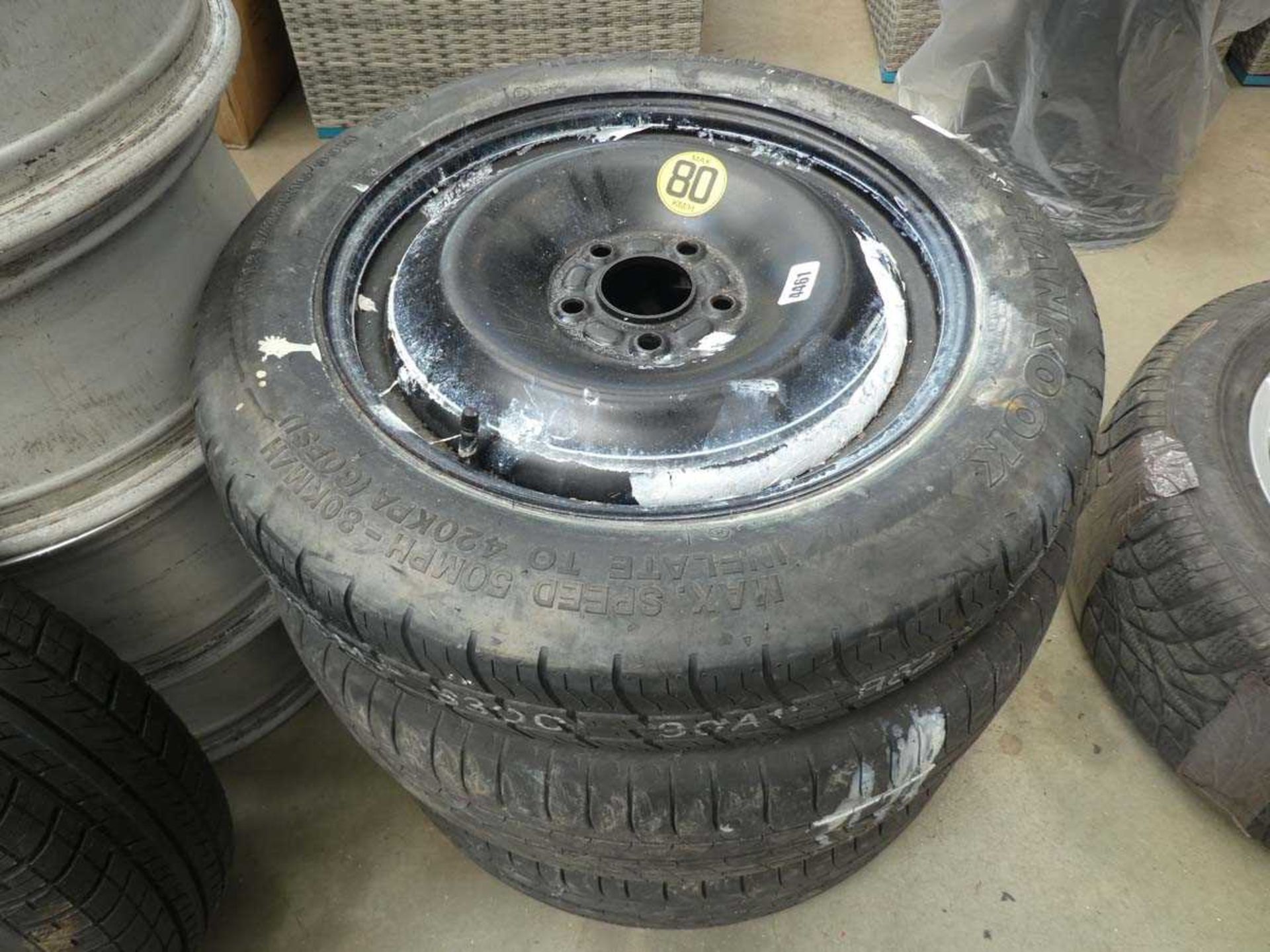 Two Ford wheels and a space saver wheel and tyre