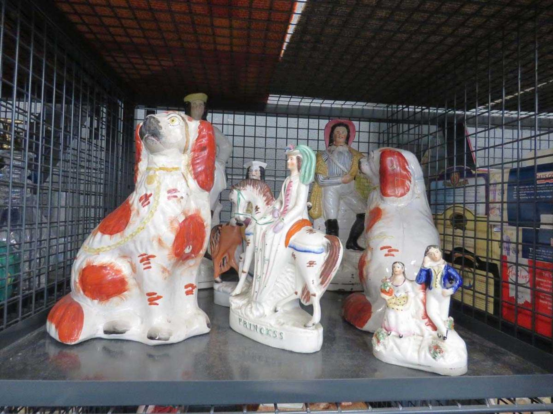 Cage containing Staffordshire flatback figures and dogs