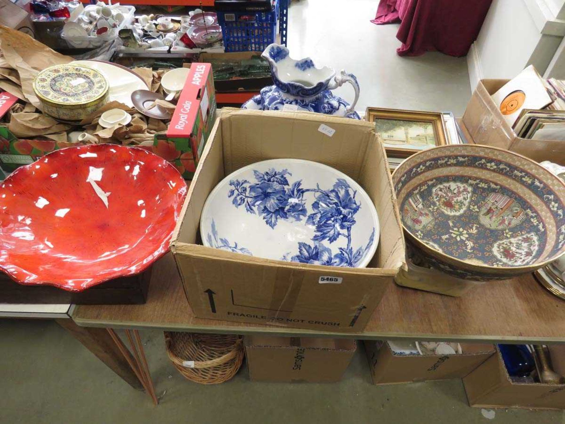Box containing 3 floral patterned and red glazed bowls