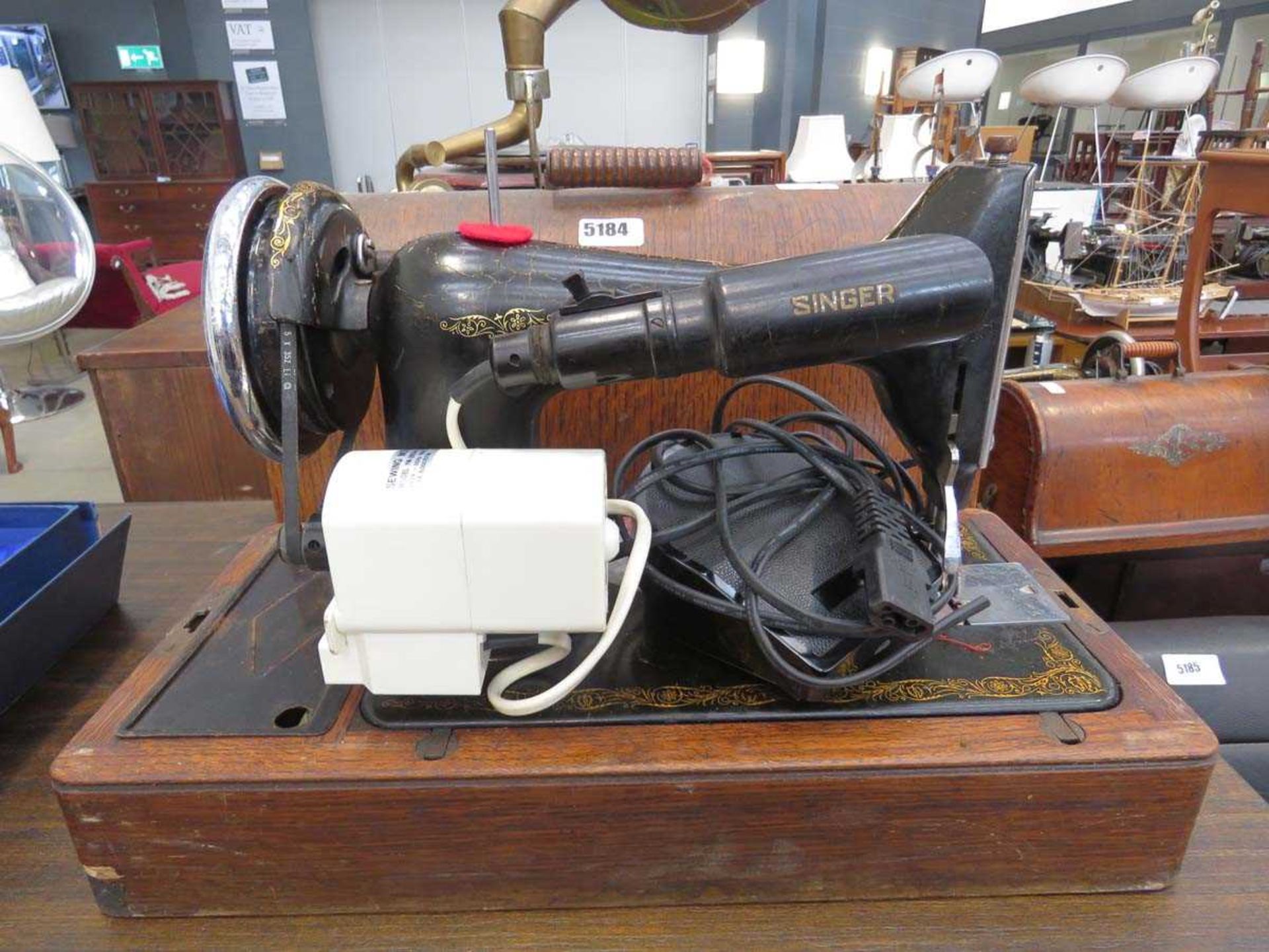 (5) Cased Singer electric sewing machine