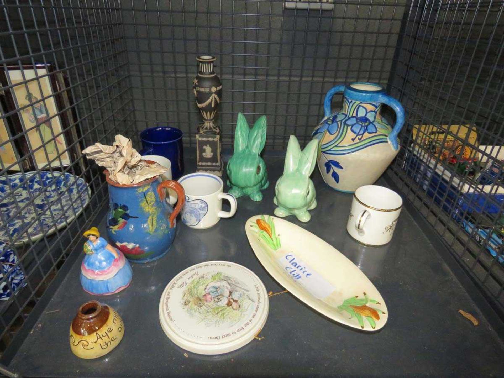 Cage containing a Clarice Cliff maize decorated dish, Sylvac style rabbits, jasperware