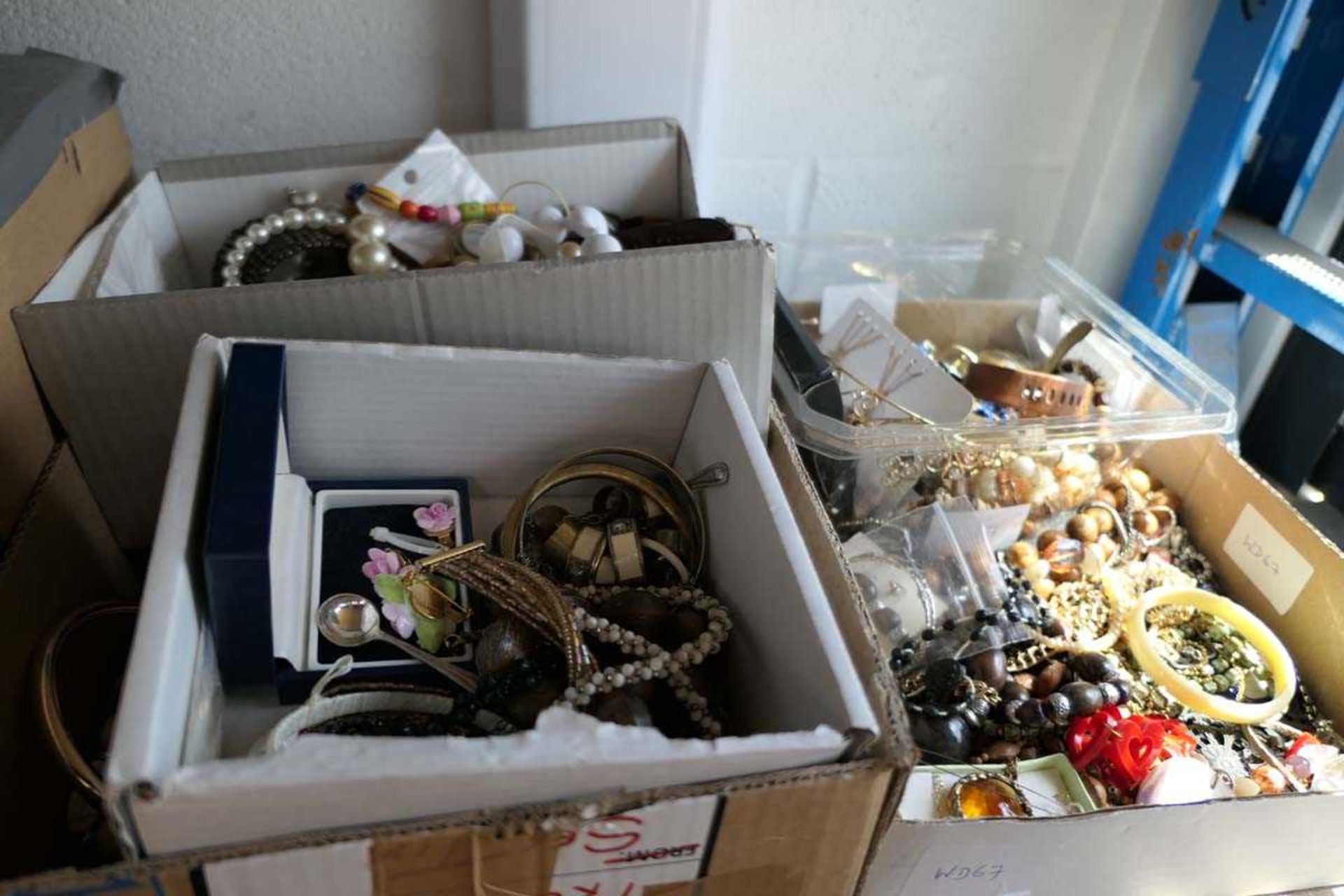 Various boxes containing costume jewellery items, watches, bracelets, earrings etc.