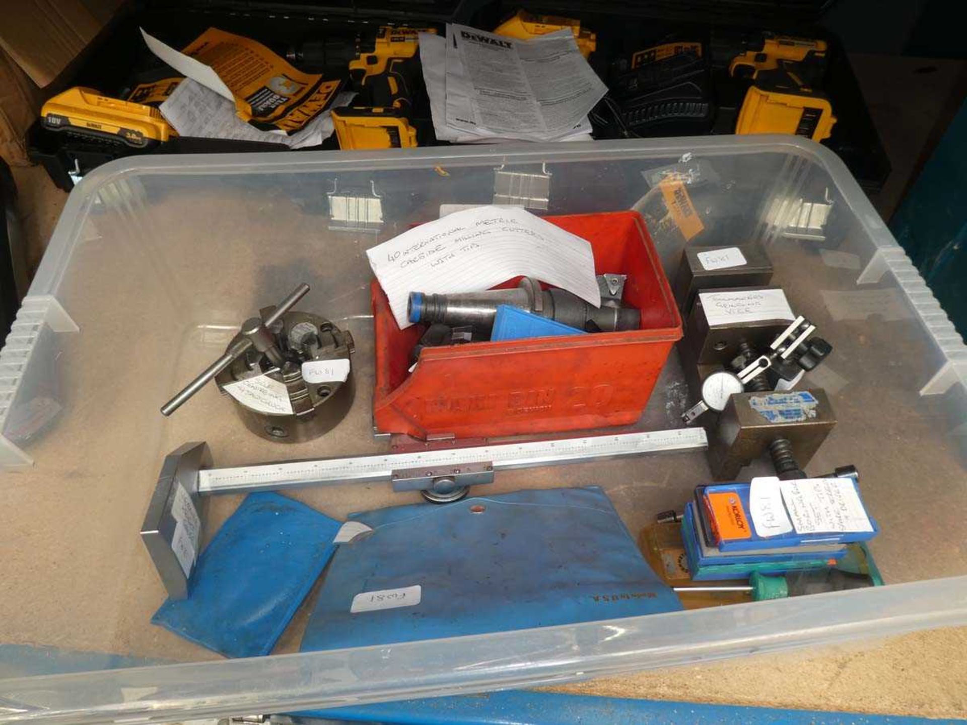 Box containing Vernier height gauge, self centring four drawer chuck, milling cutters, toolmakers