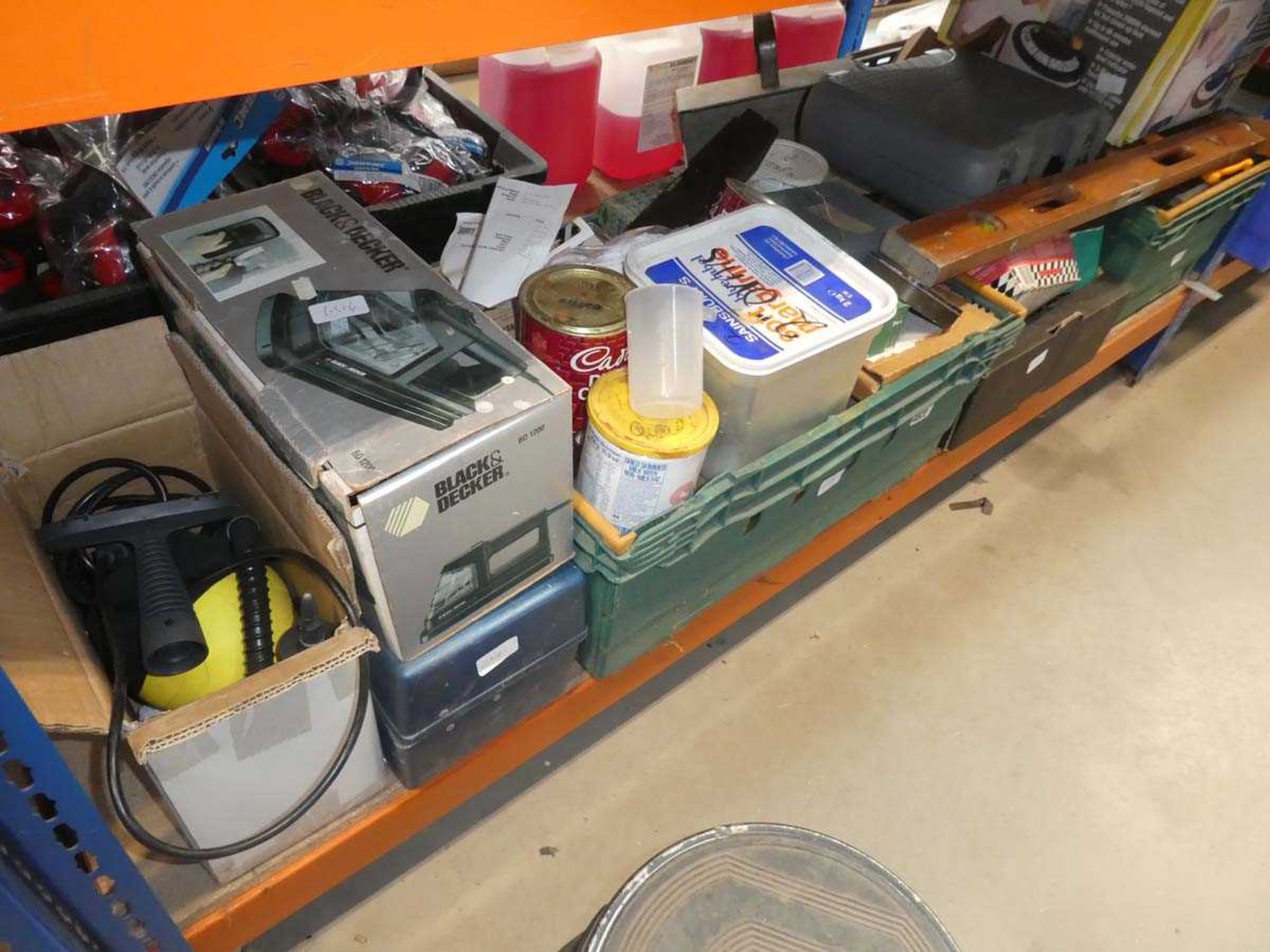 Large under bay containing wallpaper stripper, fixings, spirit level, saws, sanders, etc.