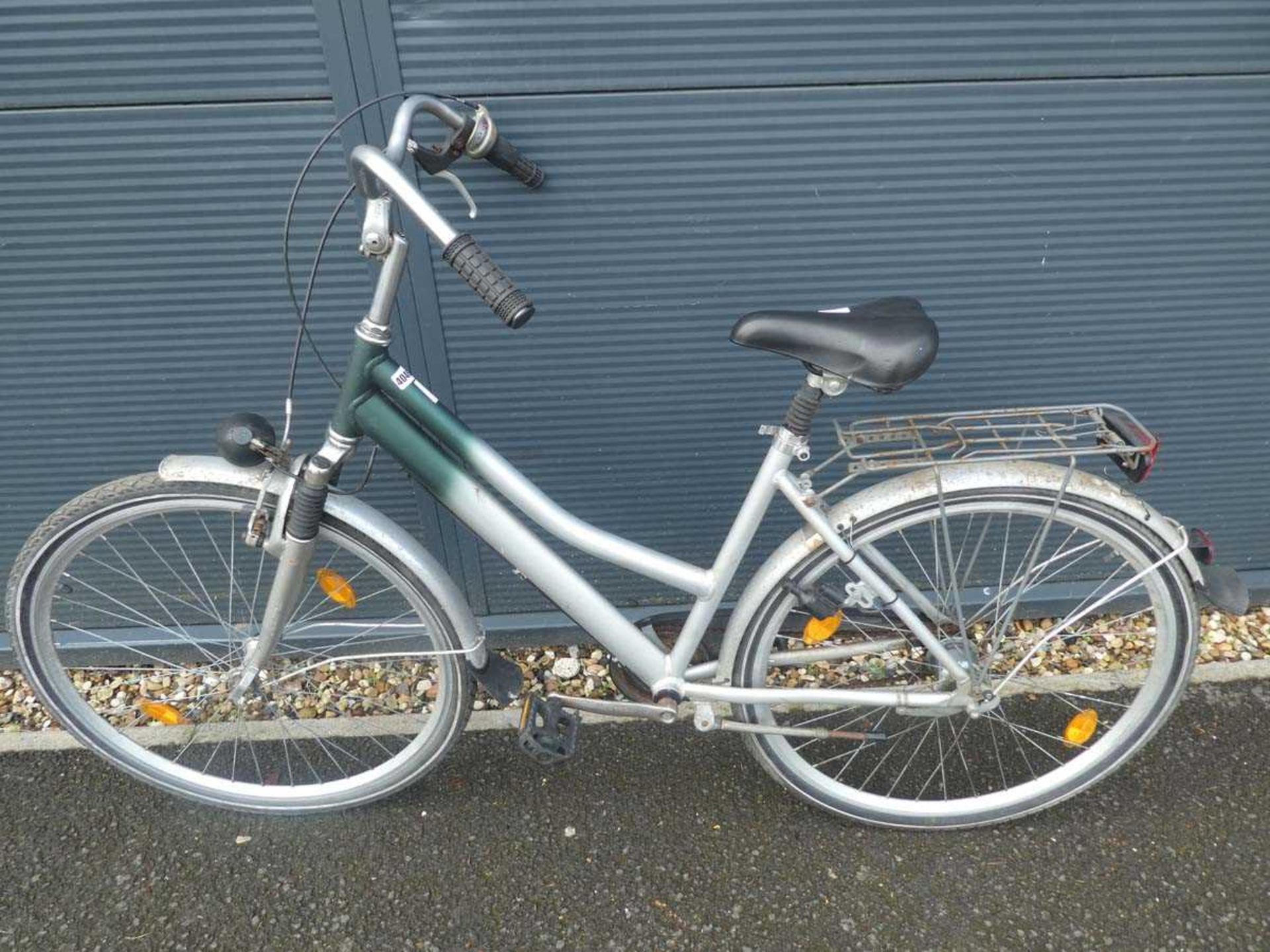 Silver and green ladies bike