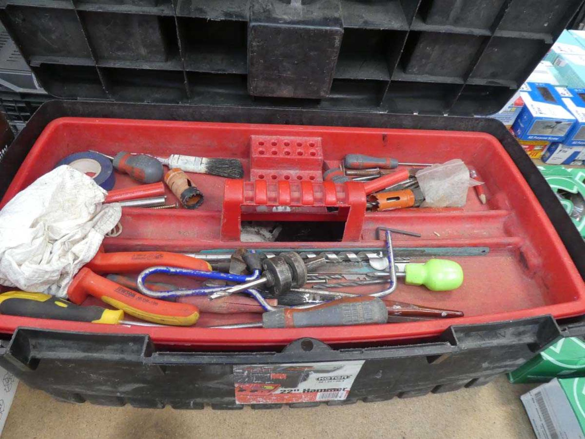 Plastic toolbox containing various tools incl. screwdrivers, pliers, files, etc.