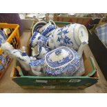 Box containing blue and white crockery