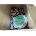 Box containing plastic trains and track