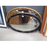 +VAT 2 x oval mirrors in ebonised and gilt frames