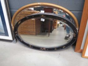 +VAT 2 x oval mirrors in ebonised and gilt frames