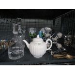 Cage containing drinks optic, decanters, wine glasses, nut cracker, corkscrew