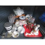 Cage containing vintage radio, wine glasses, biscuit barrel, ornamental figures and china