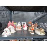 Cage containing Hummel figures, bookends, ornamental windmill and pastille burners