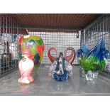 Cage containing glass vases, ornaments, and bottle with stopper