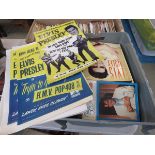 Box containing Elvis Presley books and memorabilia