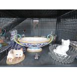Cage containing wristwatch, ornamental cottage, fruit bowl, glass ornament, and ice bucket
