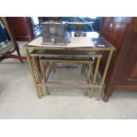 Brass and glazed nest of 3 tables