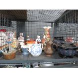 Cage containing paper mache pots, brass jug, egg with spoons, ornaments, and glassware