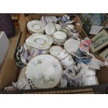 Box containing a quantity of floral patterned crockery