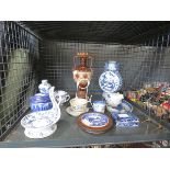 Cage containing oriental ceramics inc. moon flask, jugs and lidded pots