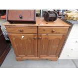 Modern pine sideboard, two drawers over two doors