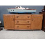 Ercol sideboard with three central drawers