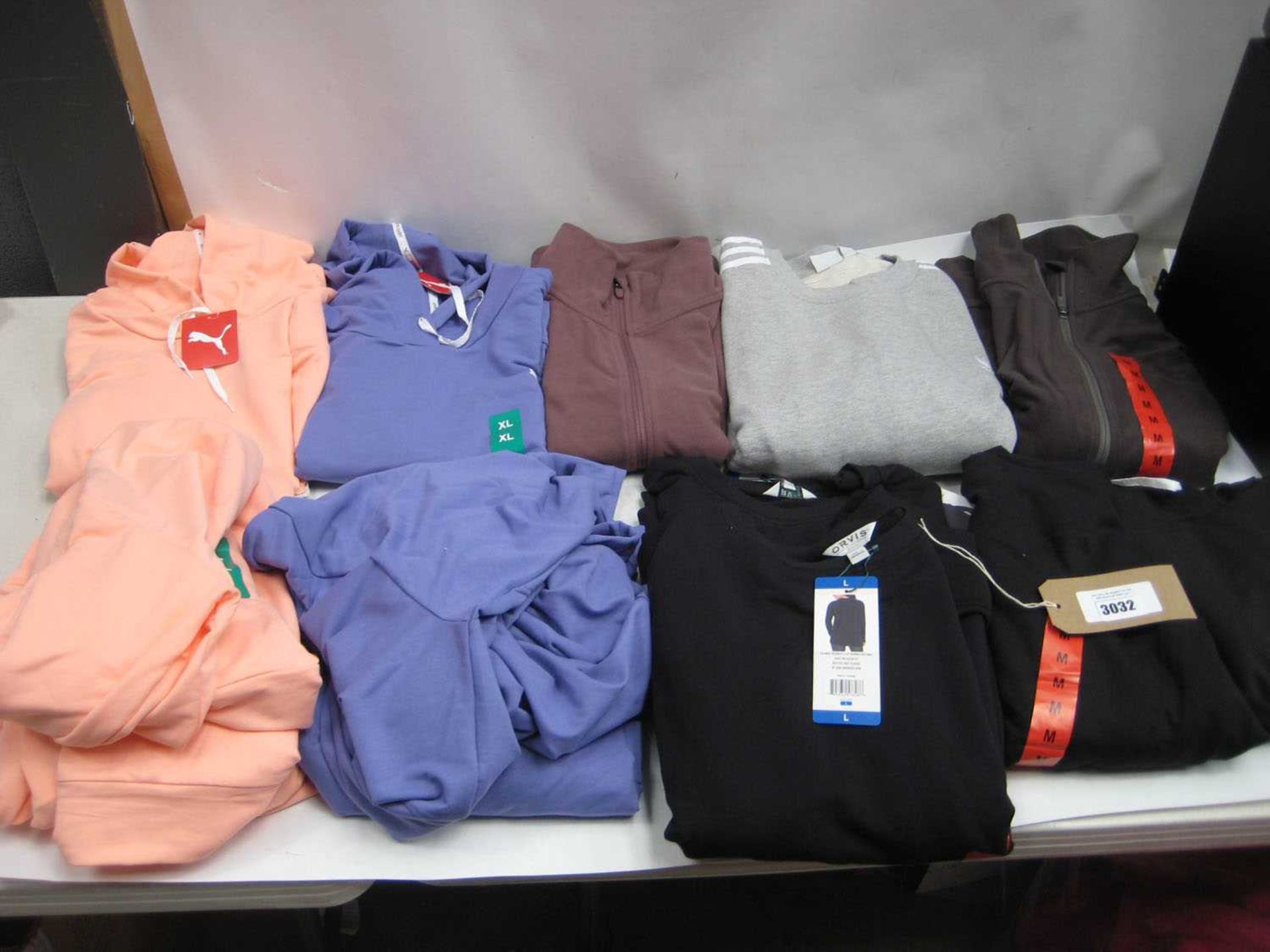 +VAT A bag containing Ladies Clothing in various sizes, including Adidas, Puma