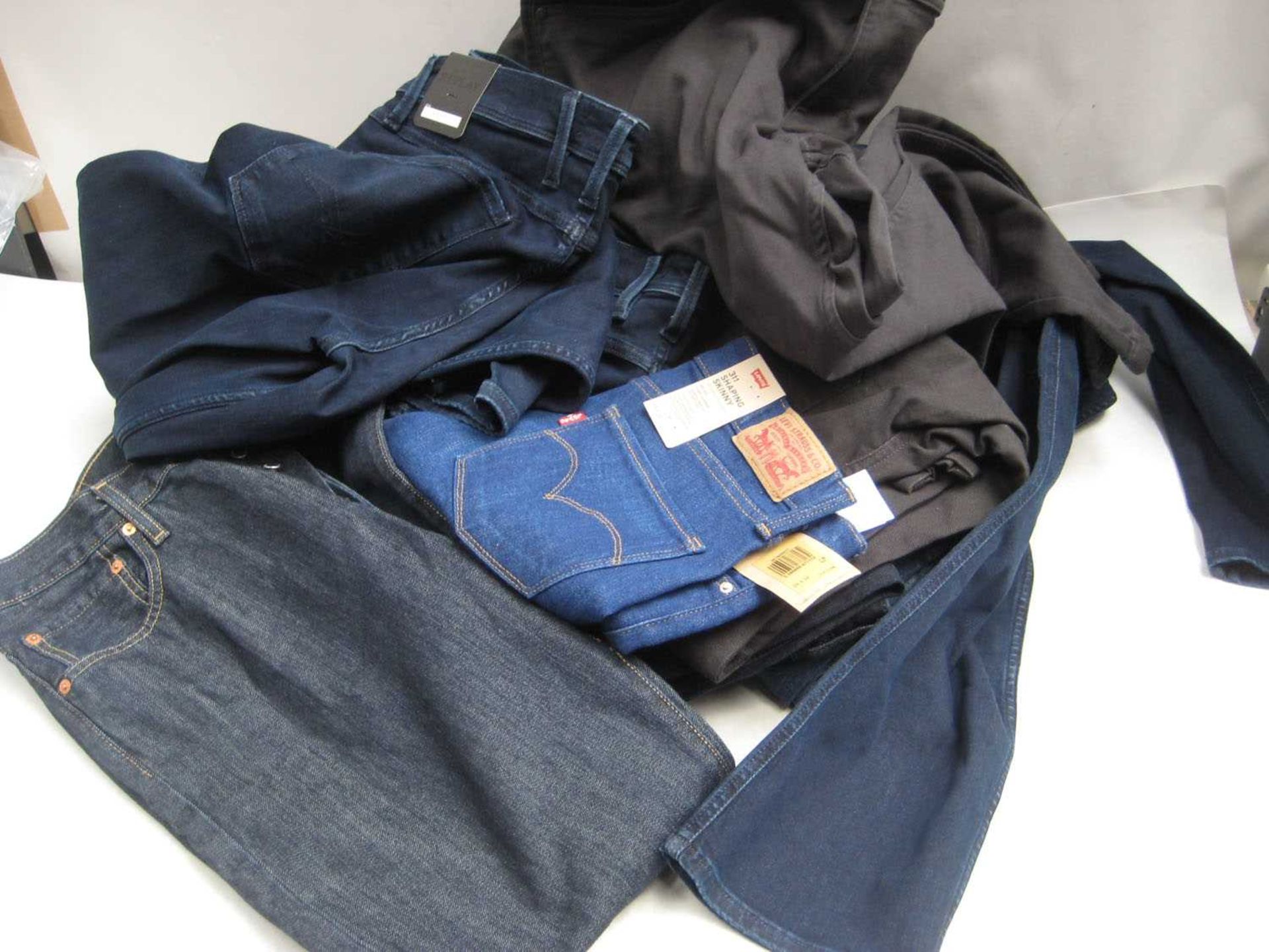 +VAT A bag containing Men's and Ladies Jeans in various sizes, including Levi's, Reply, Urban Star