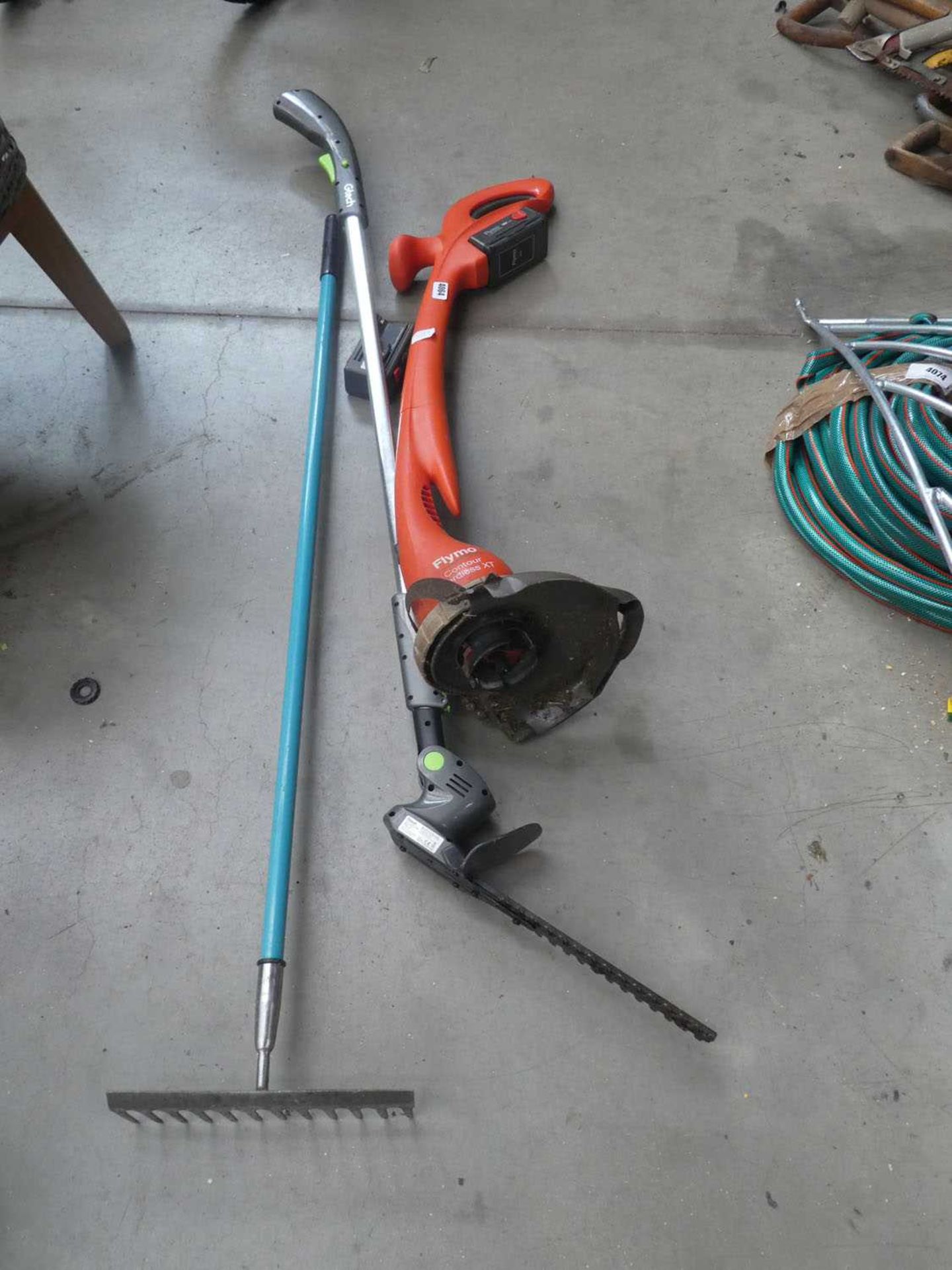 Flymo battery powered strimmer, 2 batteries, no charger, and small rake and GTech strimmer