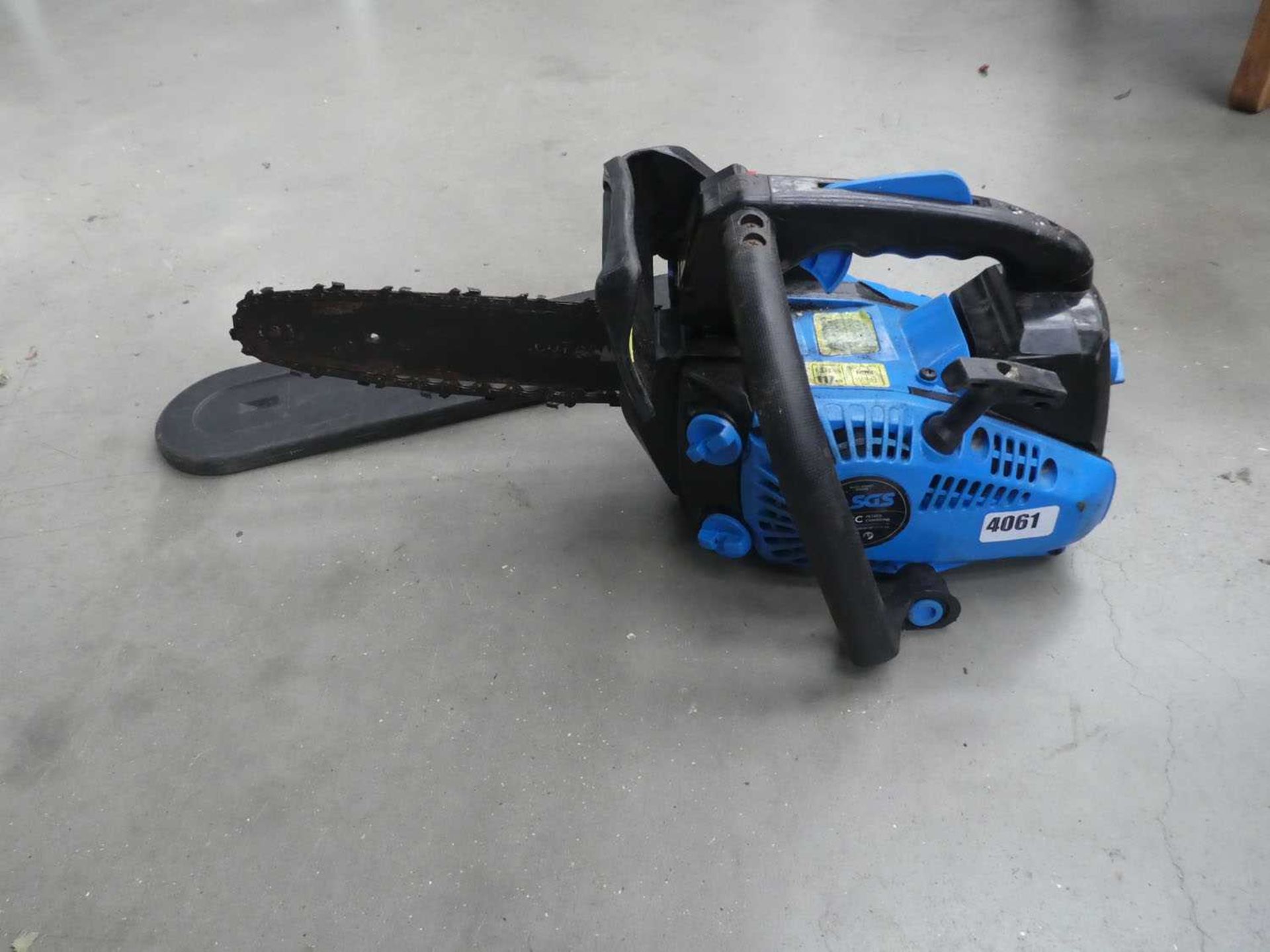 Blue small petrol powered chainsaw