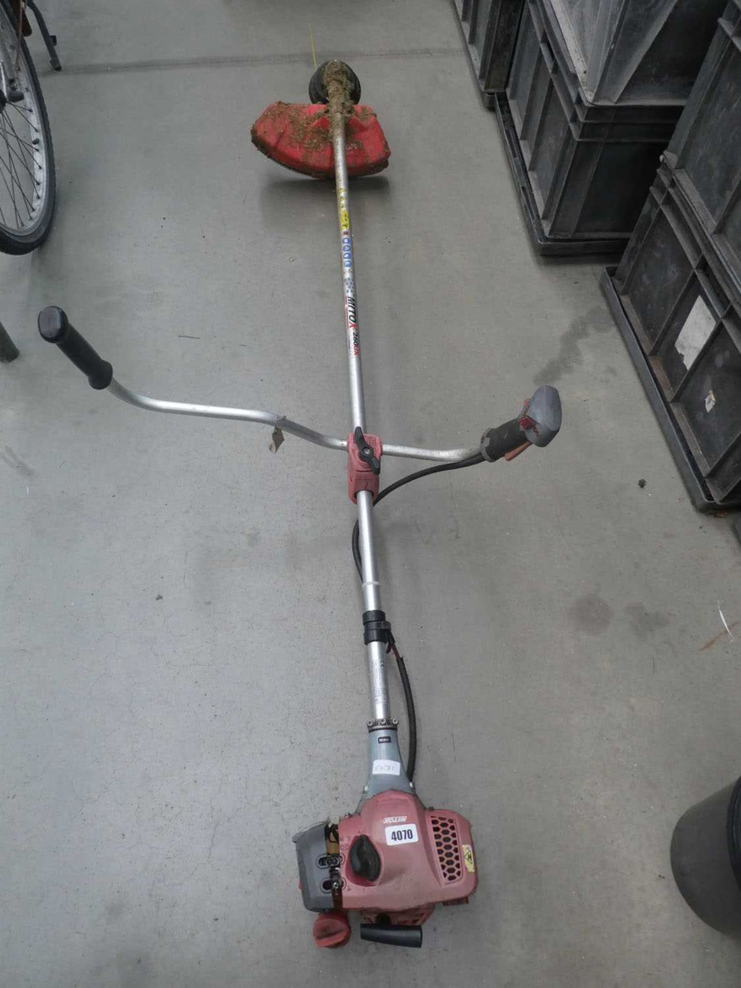 Mitox red petrol powered strimmer