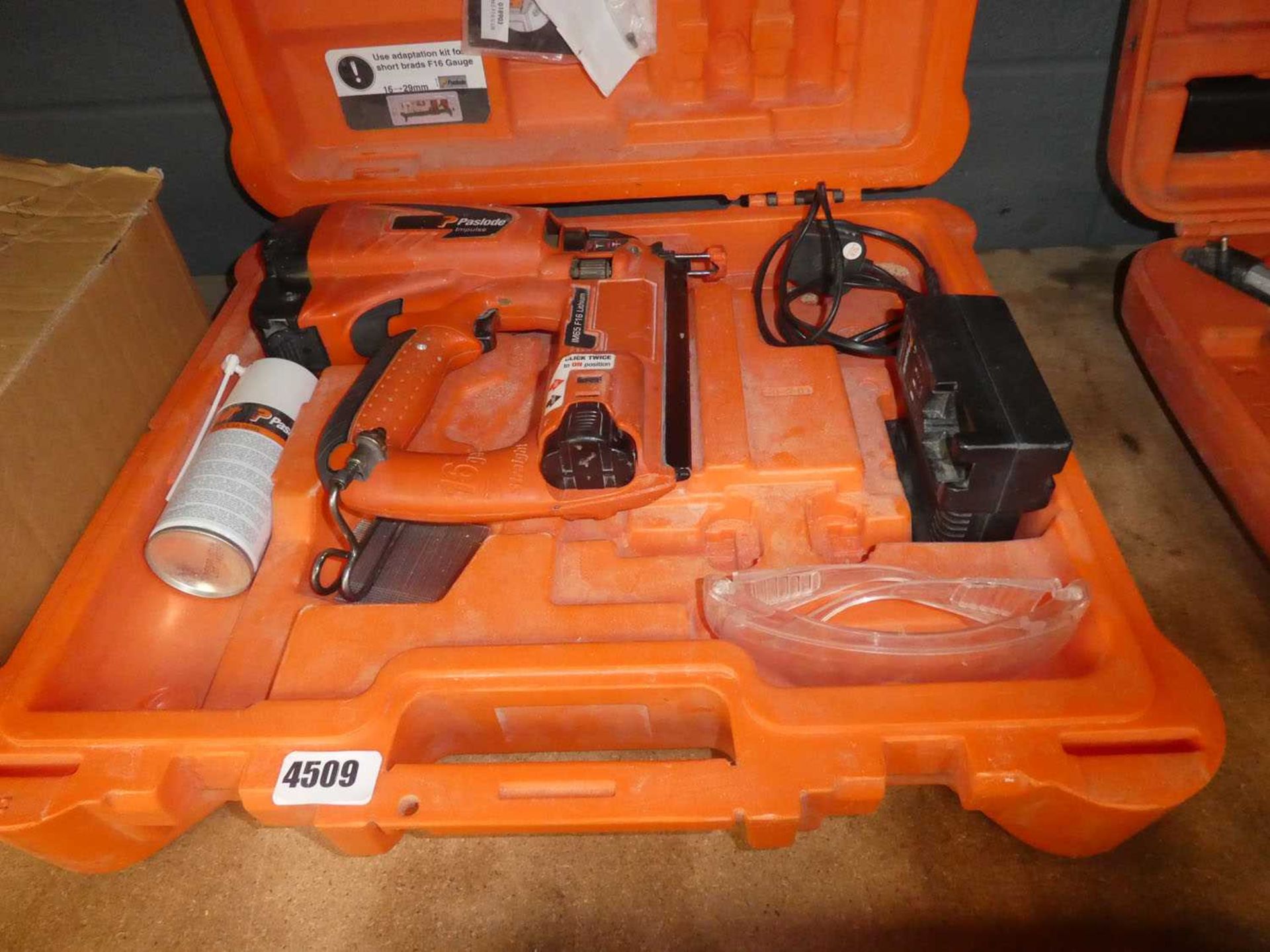 Paslode Impulse IM65 F16 nail gun with one battery, charger and cartridges