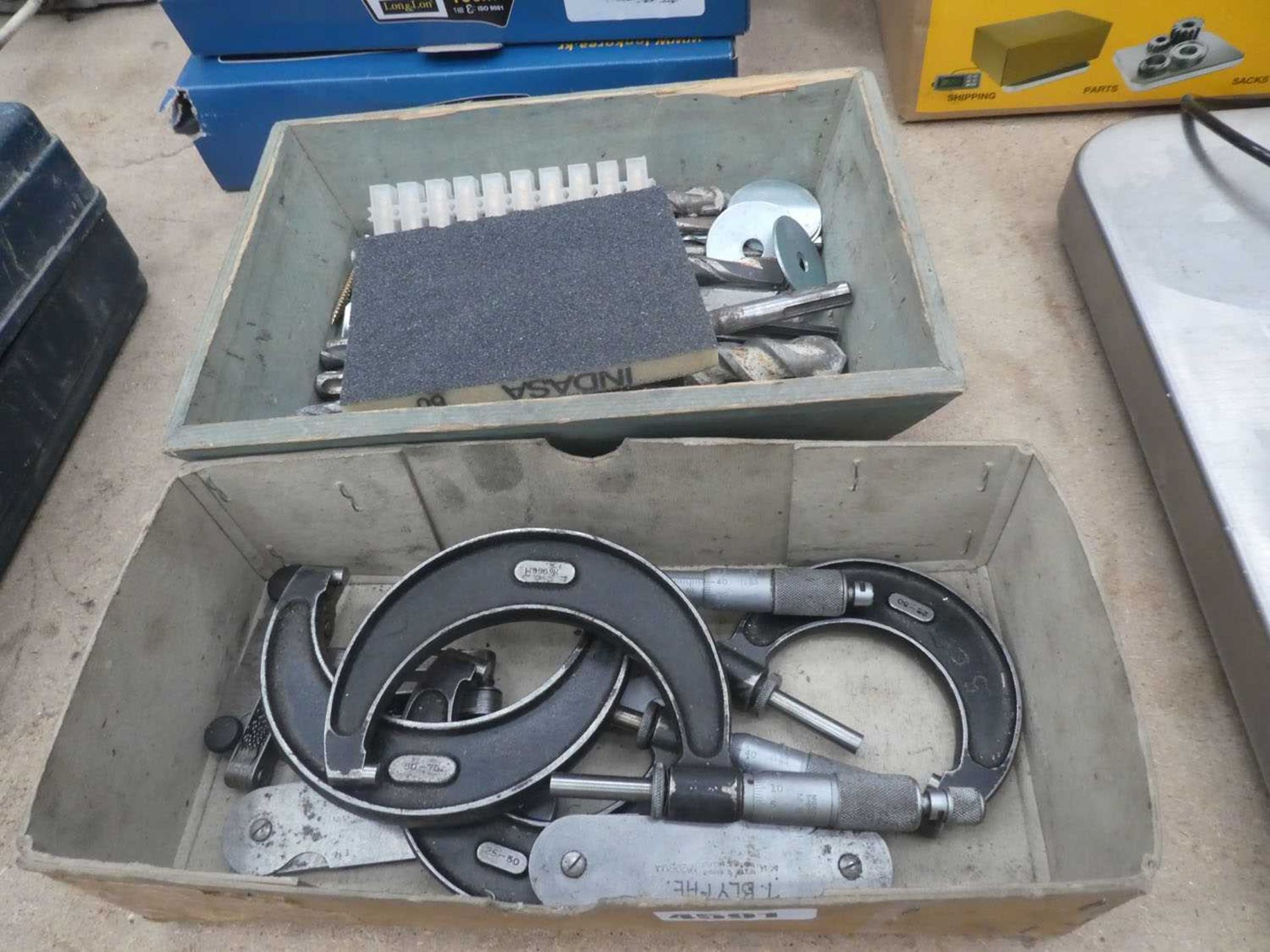 Box containing small measuring gauges, micrometers and drill bits