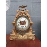 Metal mantle clock with lions and Britannica moldings