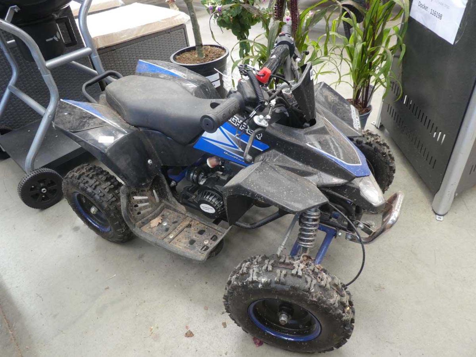 Black and blue small childs petrol powered quadbike