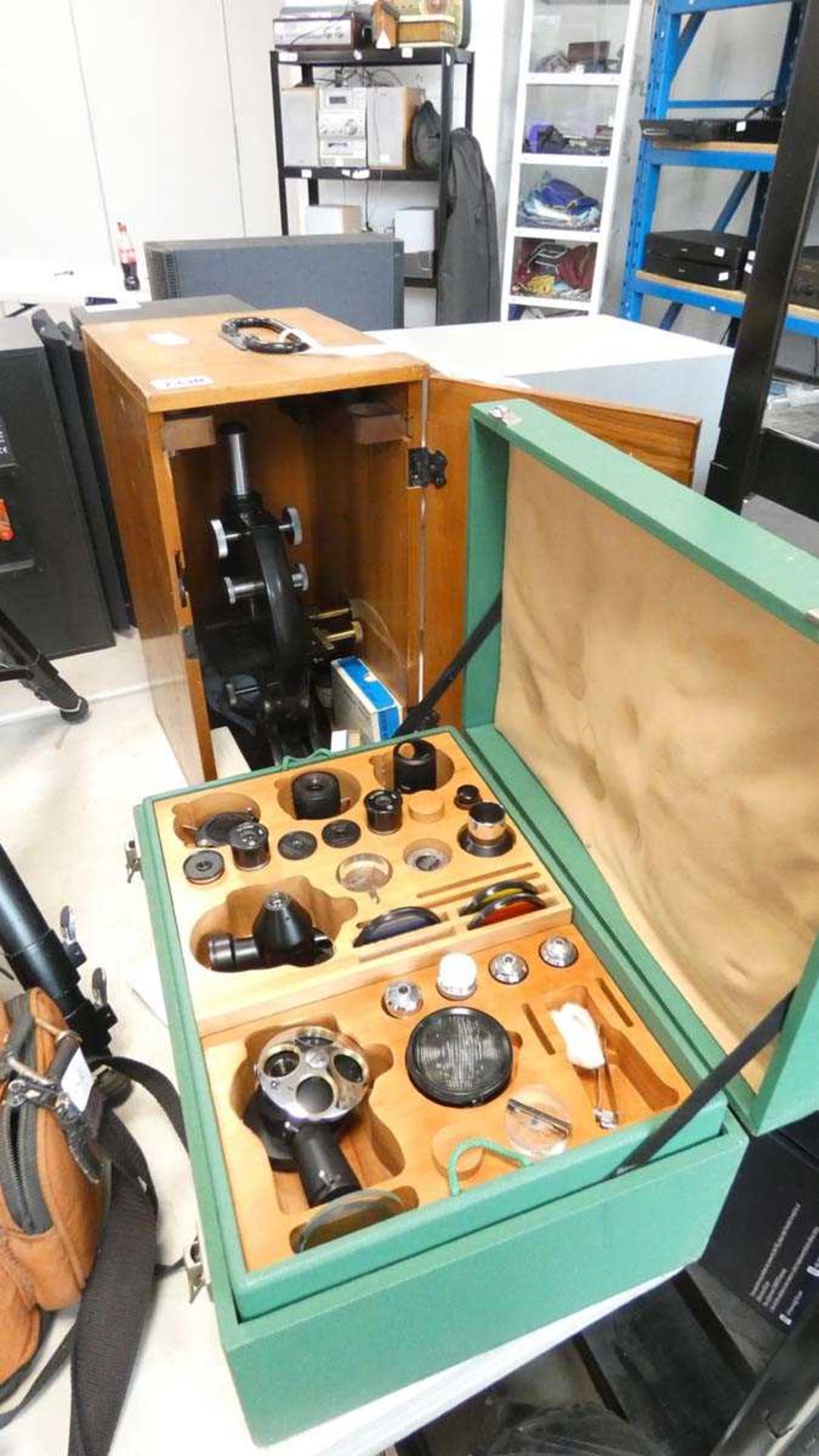 Student microscope with wooden case and a further green case with various filters and other