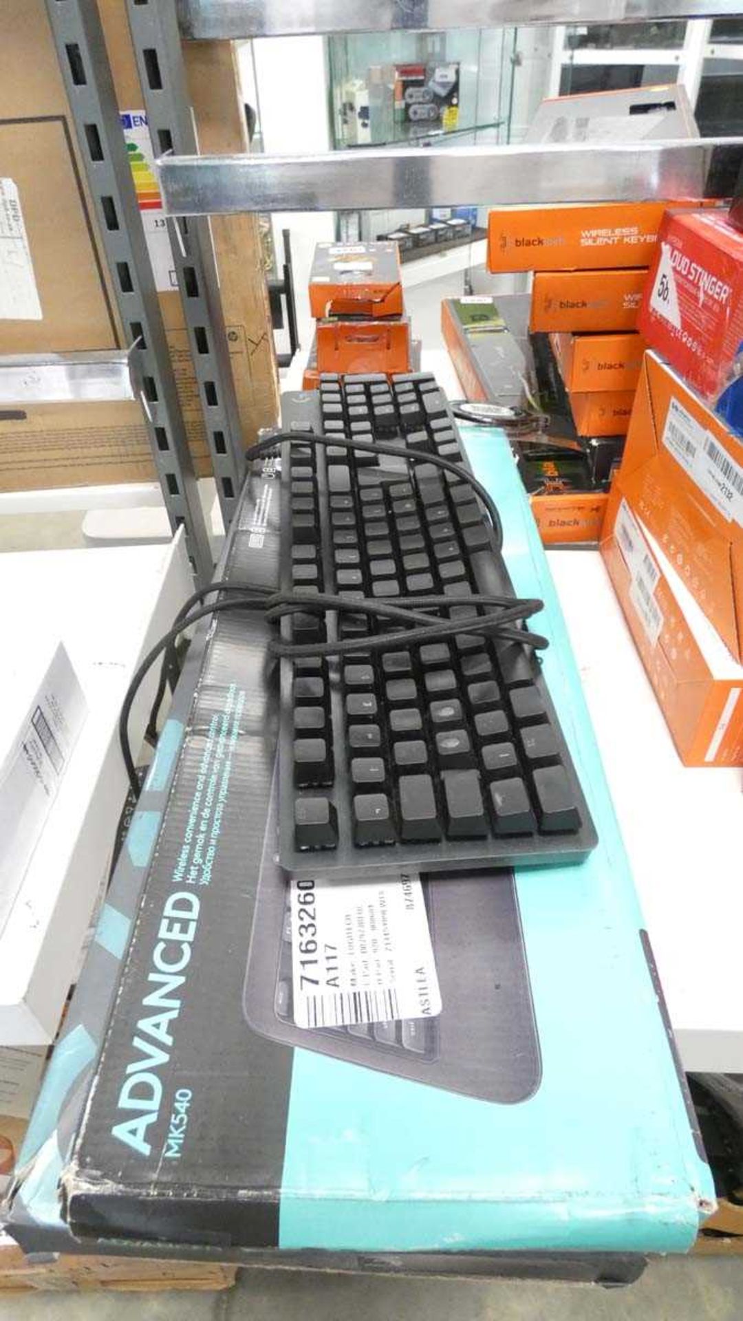 2 boxed and 1 unboxed Logitech keyboard sets