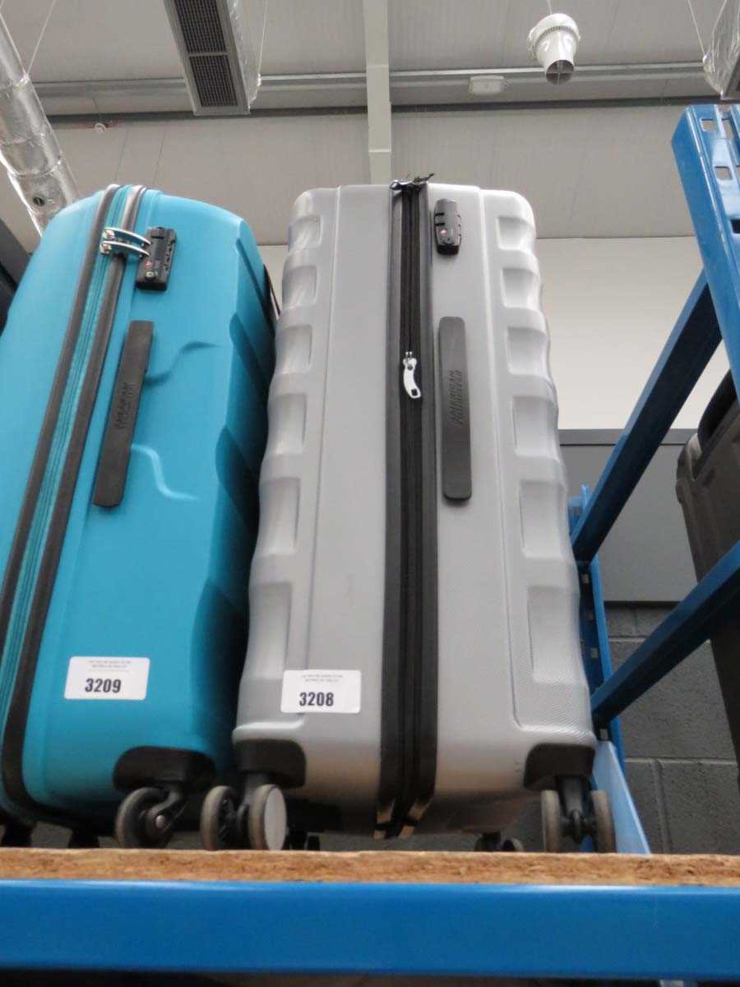 +VAT Large hard-shelled American Tourister suitcase